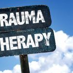 Trauma Therapy sign with sky background