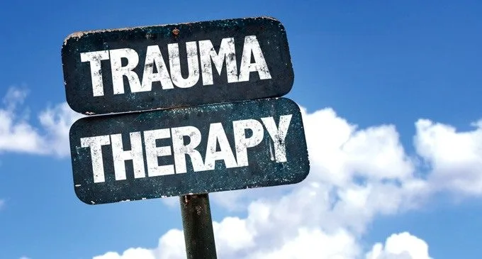 Trauma Therapy sign with sky background